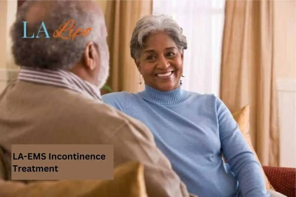 Couple sat smiling at each other - LA-EMS treatment Witney