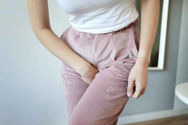 woman running for the toilet because of urinary incontinence Witney